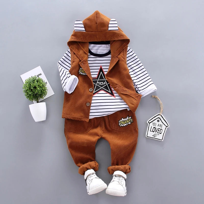 Children's outfit with brown vest, striped shirt, and pants on a gray background