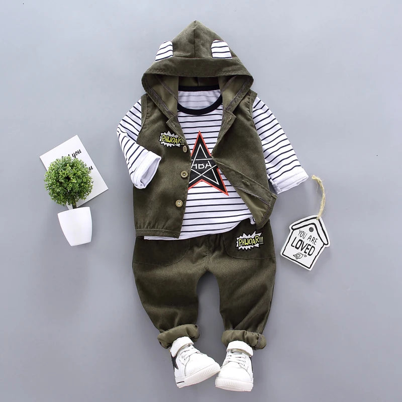 Children's outfit with hooded jacket, striped shirt, and pants on a gray background