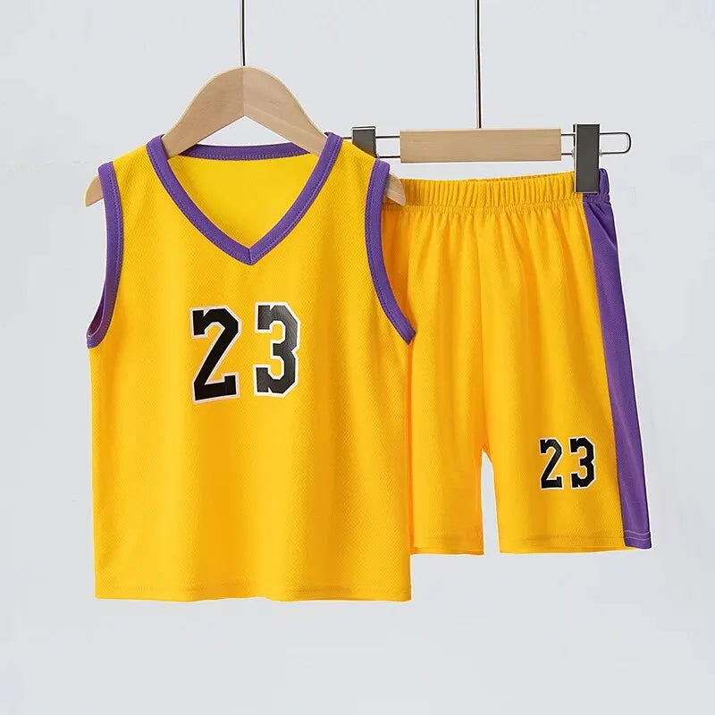Yellow basketball jersey and shorts with number 23 on a hanger against a light gray background