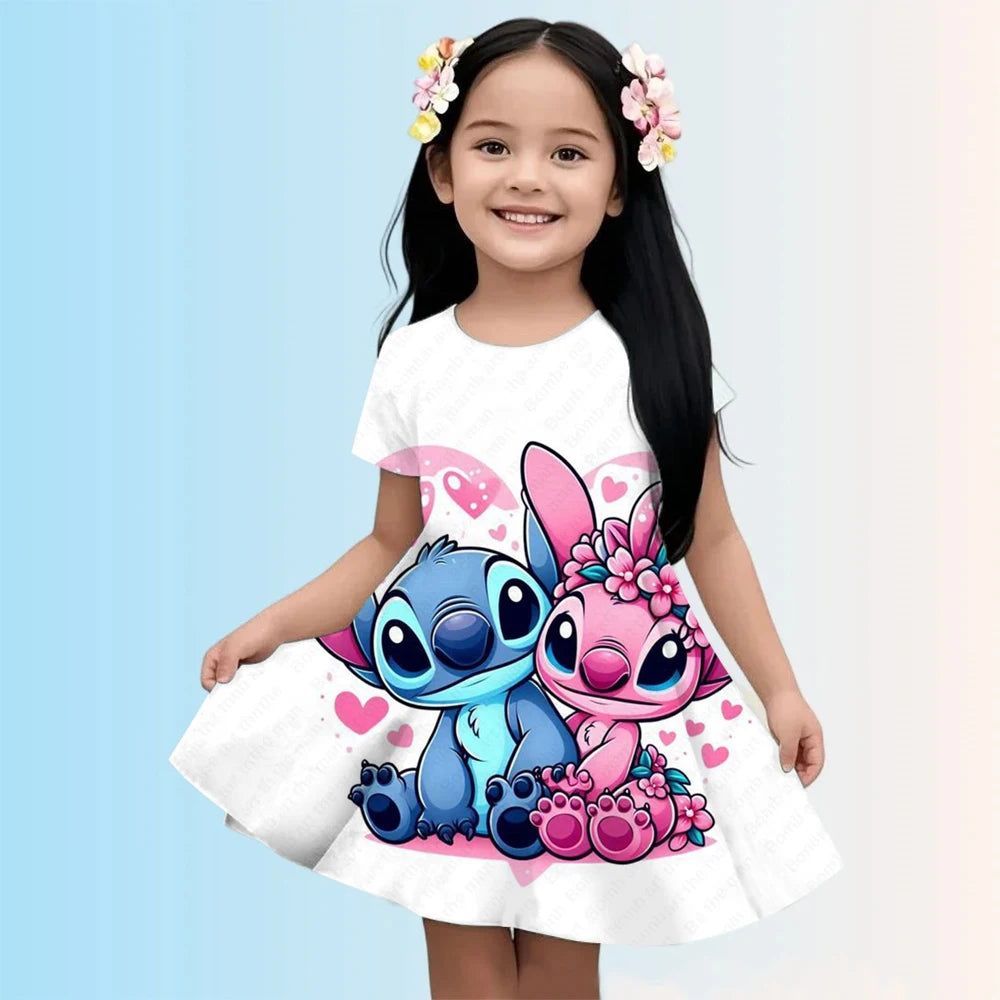 Child wearing a white dress with cartoon characters on a light blue background