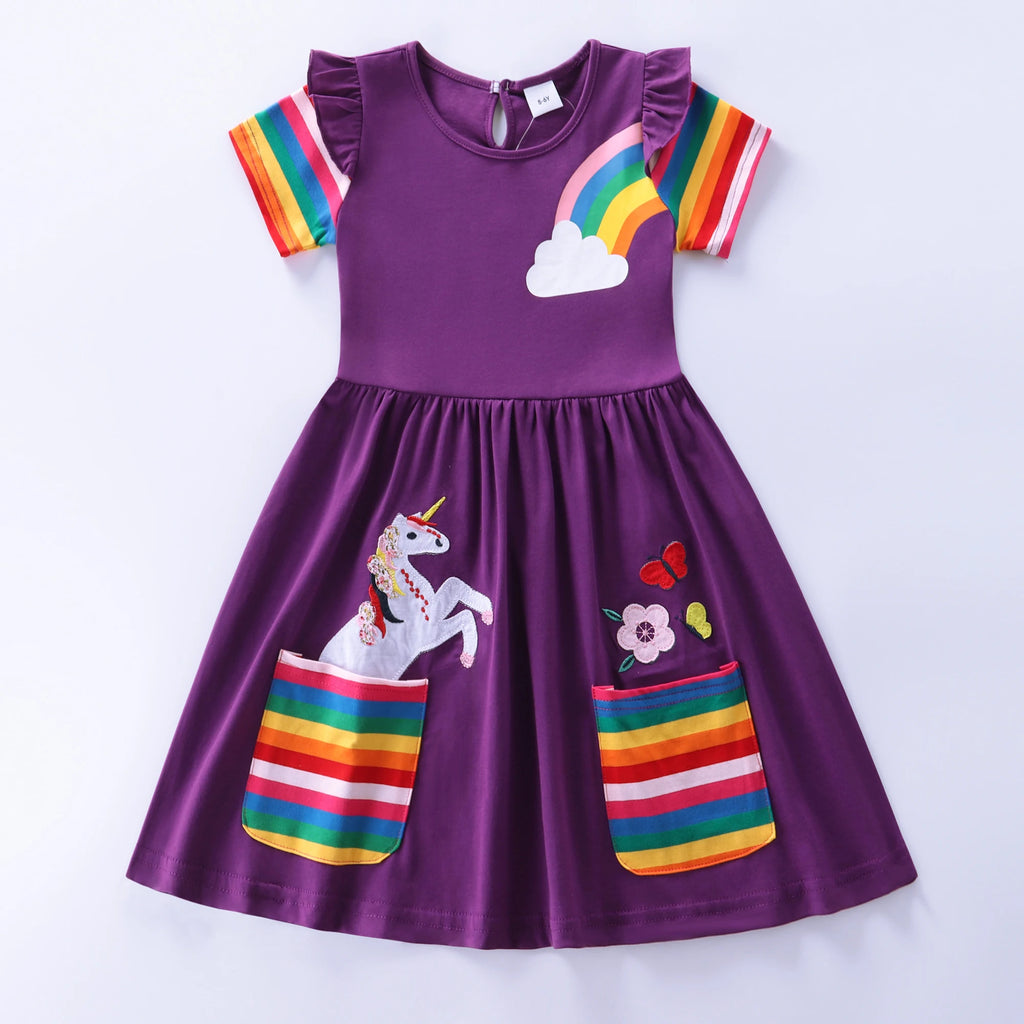 Purple dress with rainbow and unicorn designs on a white background
