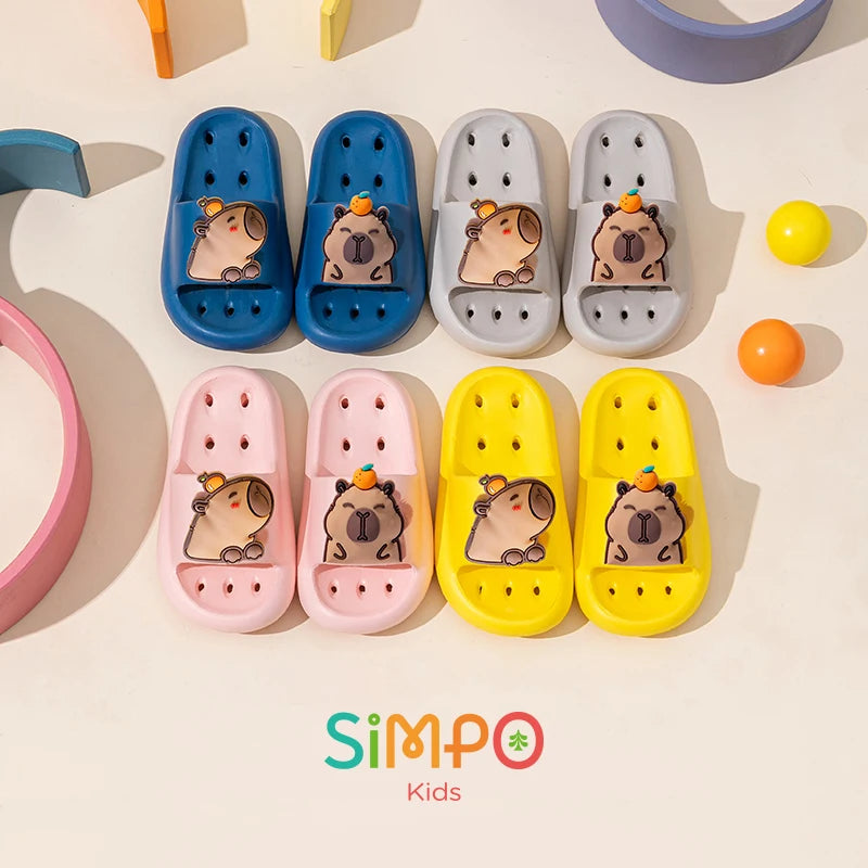 Set of colorful children's sandals with cartoon dog design on a light background, featuring the brand 'Simpo Kids'.