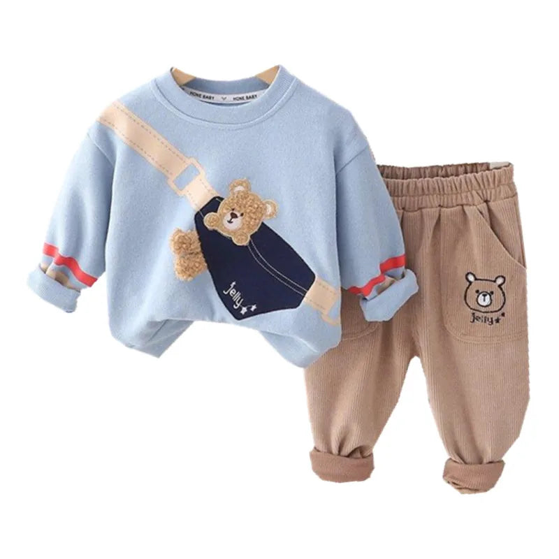 Children's outfit with blue sweater and brown pants featuring bear designs on a white background