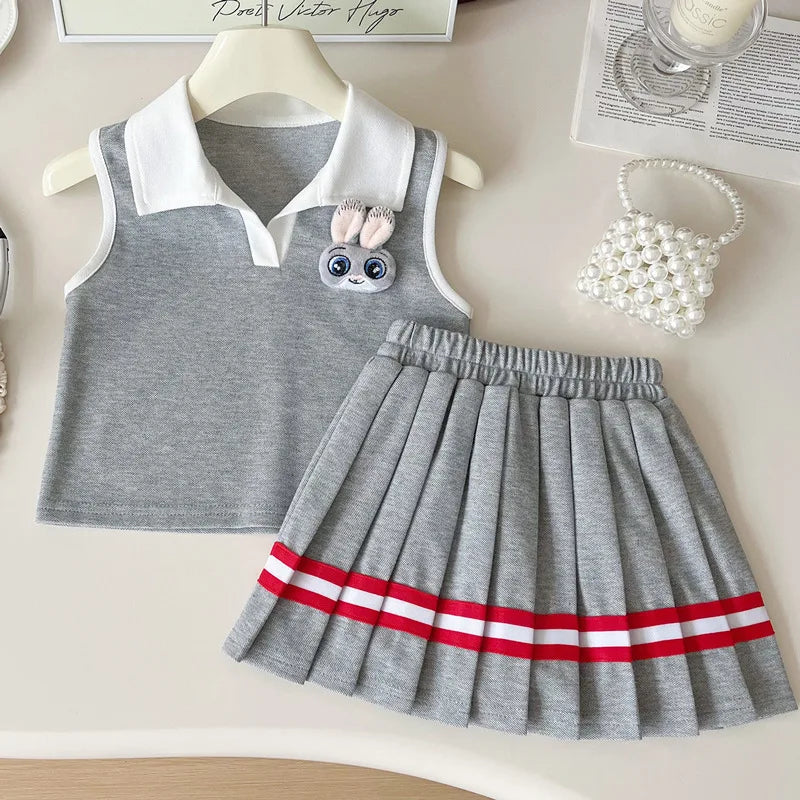 Children's gray dress with white collar and red stripes on skirt, displayed on a hanger.