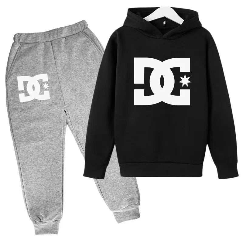Black hoodie and gray jogger pants with DC logo on a white background