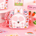 Pink children's lunch bag with cartoon character and patterns on a pink background