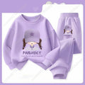 Purple children's sweatshirt and pants set with cartoon character design on a light purple background.