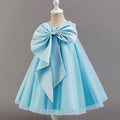 Light blue dress with a large bow on a mannequin against a gray background