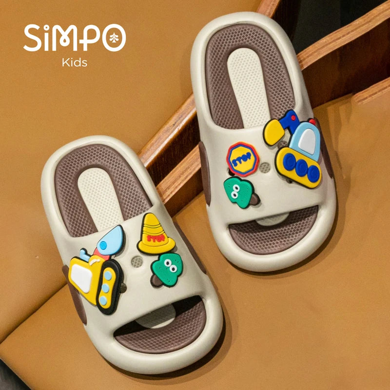 Children's sandals with colorful stickers on a wooden surface, featuring the brand 'Simpo Kids'.