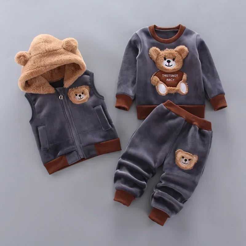 Children's clothing set with bear designs on a gray background