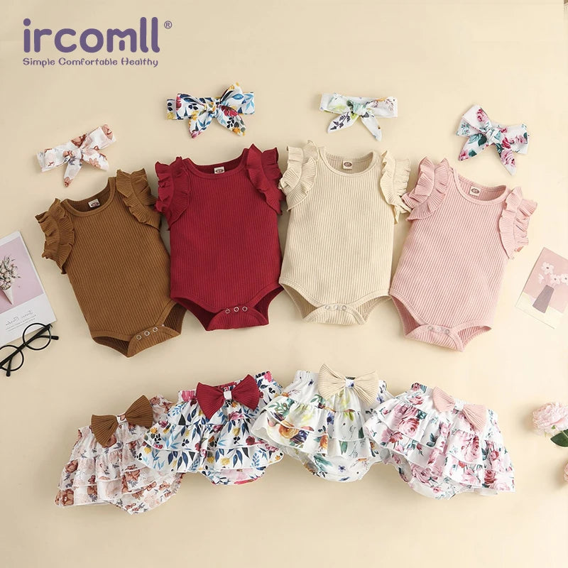 Collection of baby rompers and bloomers with accessories on a beige background, featuring the brand 'ircomll'.