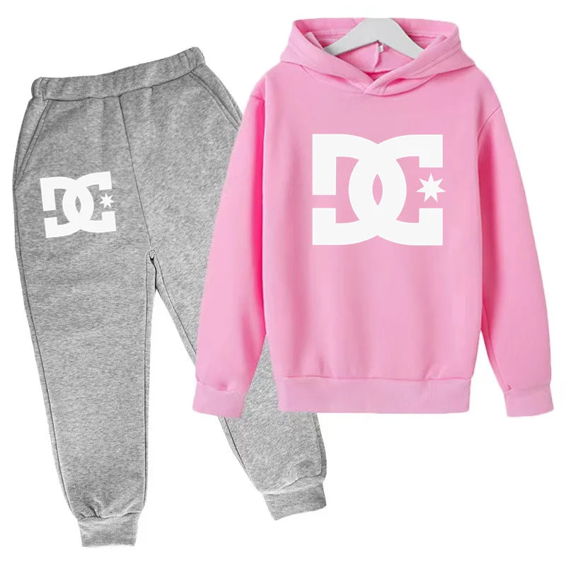 Pink hoodie and gray sweatpants with DC logo on a white background