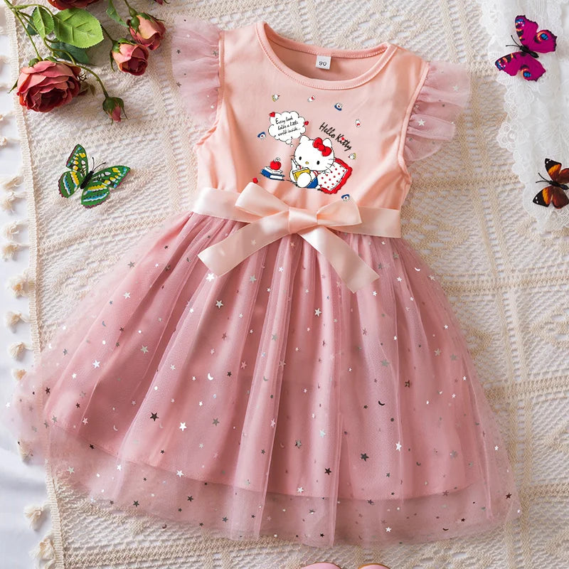Pink dress with Hello Kitty design on a textured surface with flowers and butterflies.