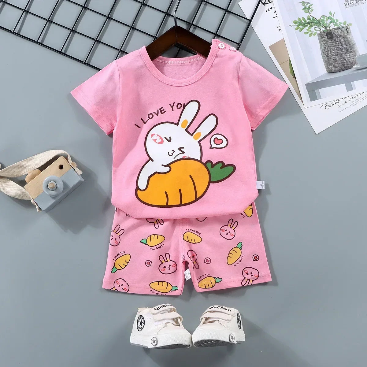 Children's pink outfit with cartoon design on a gray background