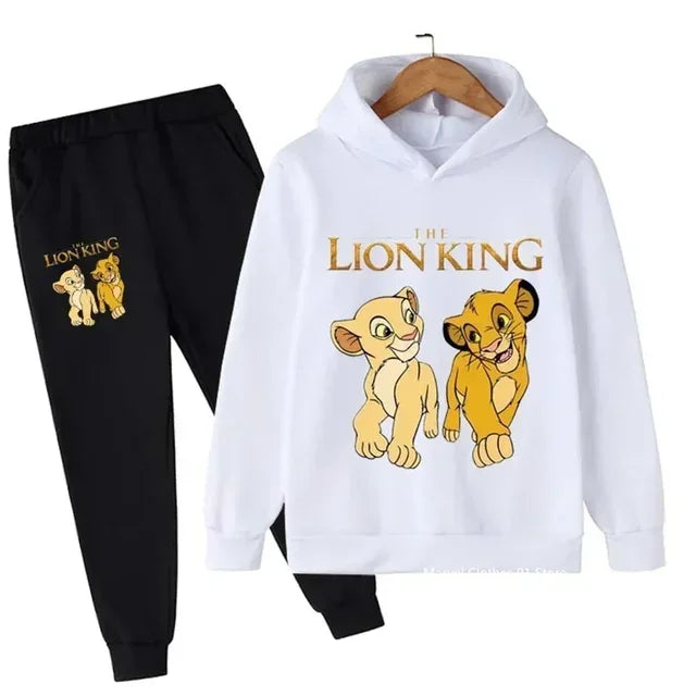 White hoodie with 'The Lion King' design and black pants on a white background
