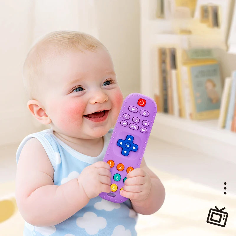 Baby holding a colorful toy remote control with a blurred background