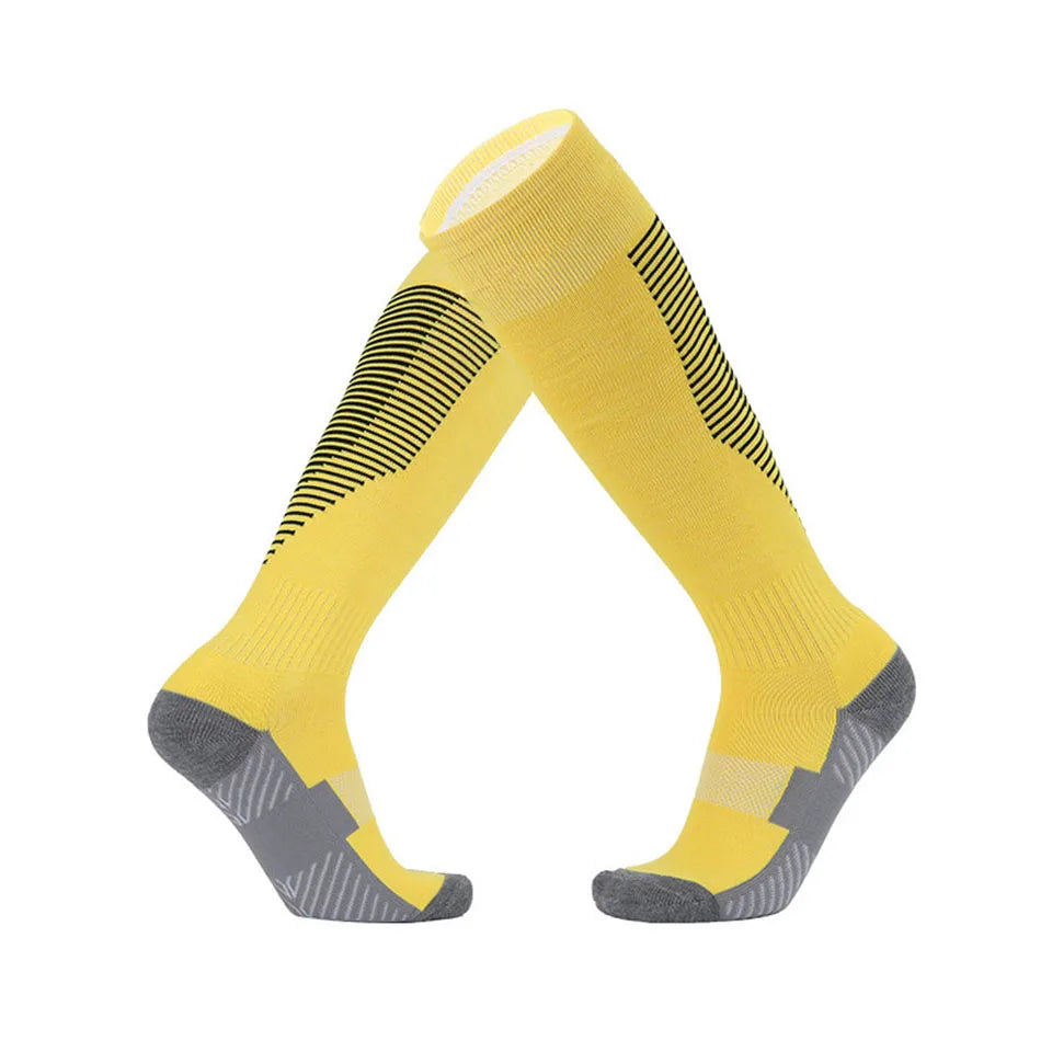 Yellow knee-high socks with black stripes on a white background