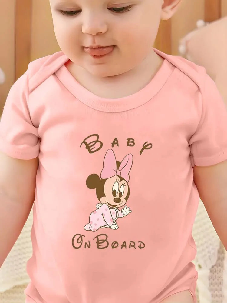 Baby wearing a pink onesie with a cartoon character and 'Baby On Board' text.