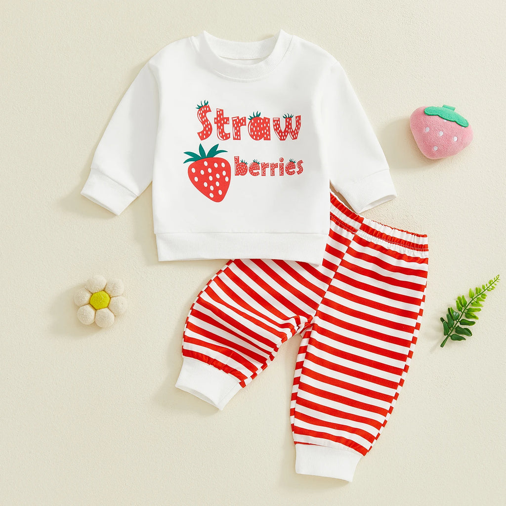 Children's outfit with white shirt and red striped pants on a beige background