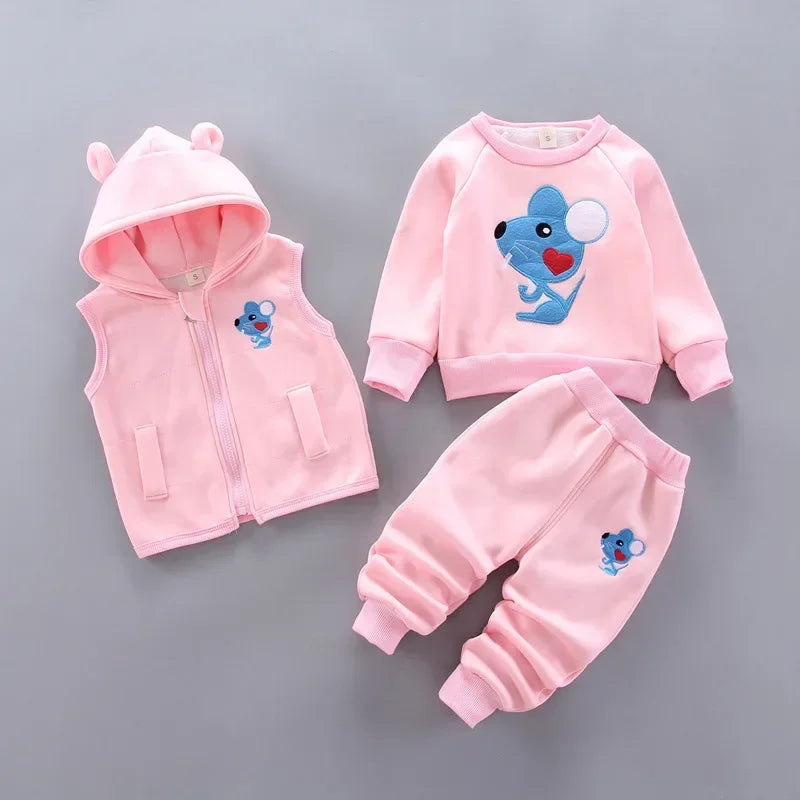 Pink children's outfit with cartoon character on a gray background