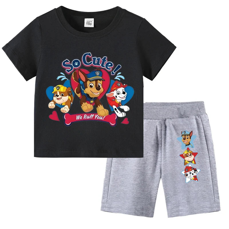 Children's black t-shirt with cartoon characters and gray shorts on a white background