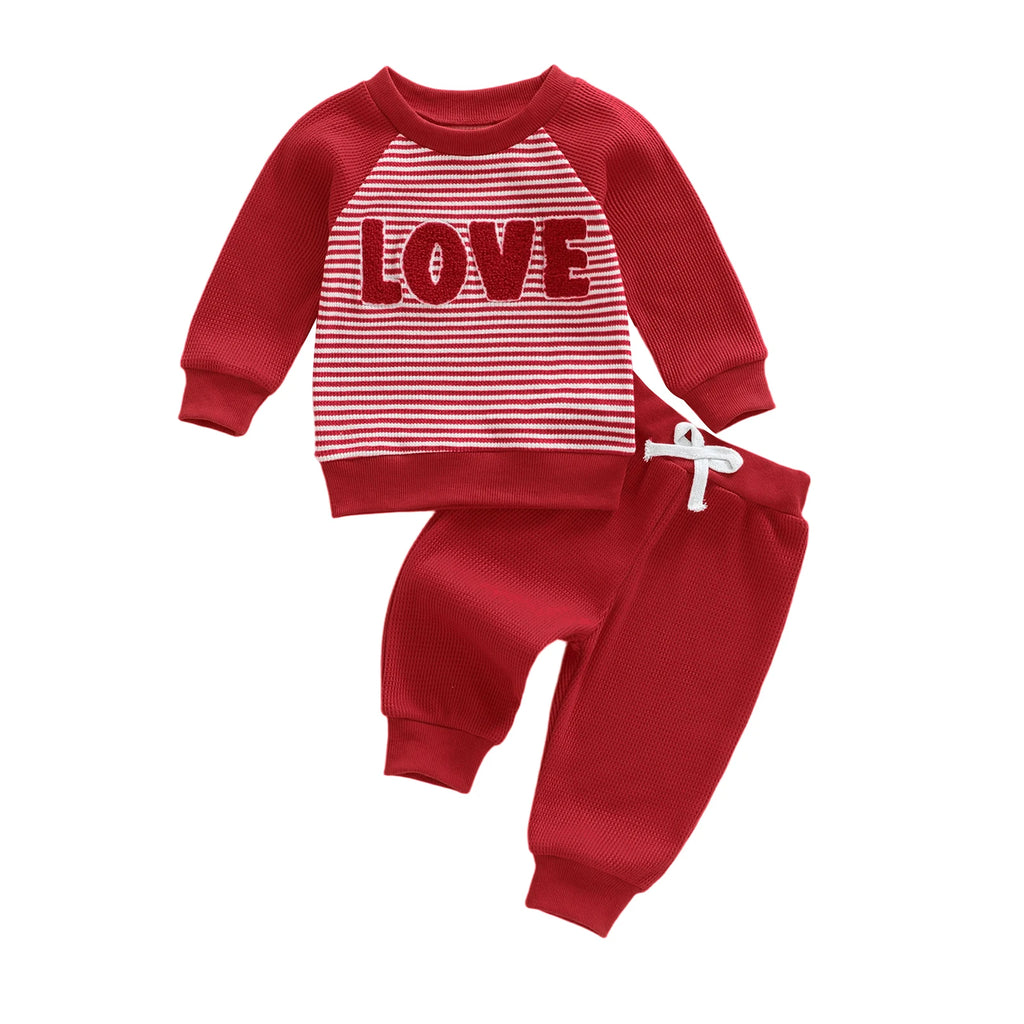 Red children's outfit with 'LOVE' print on a white background