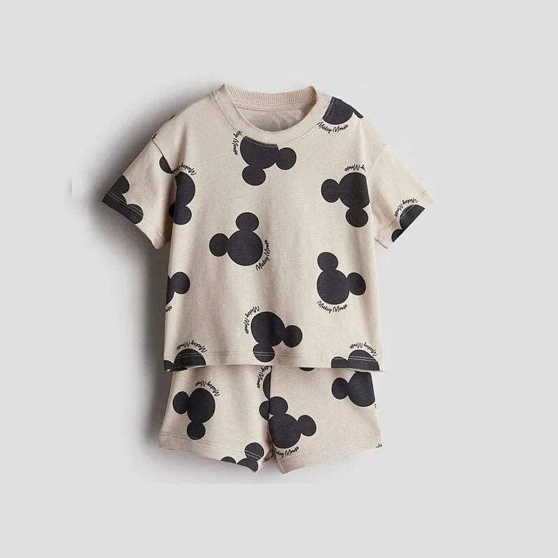Children's pajama set with Mickey Mouse pattern on a light gray background