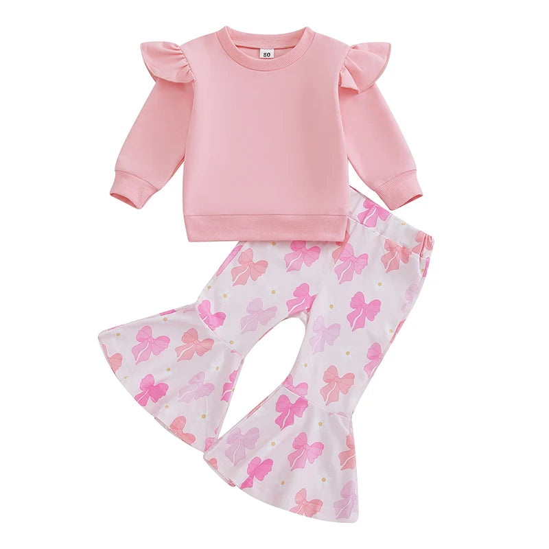Pink sweatshirt and floral-patterned pants set on a white background