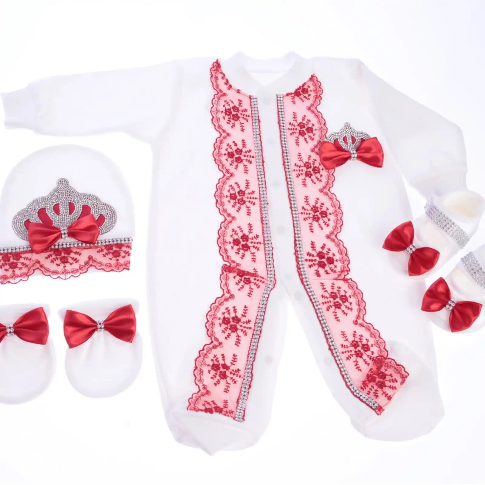 Baby outfit set with red lace and bow details on a white background