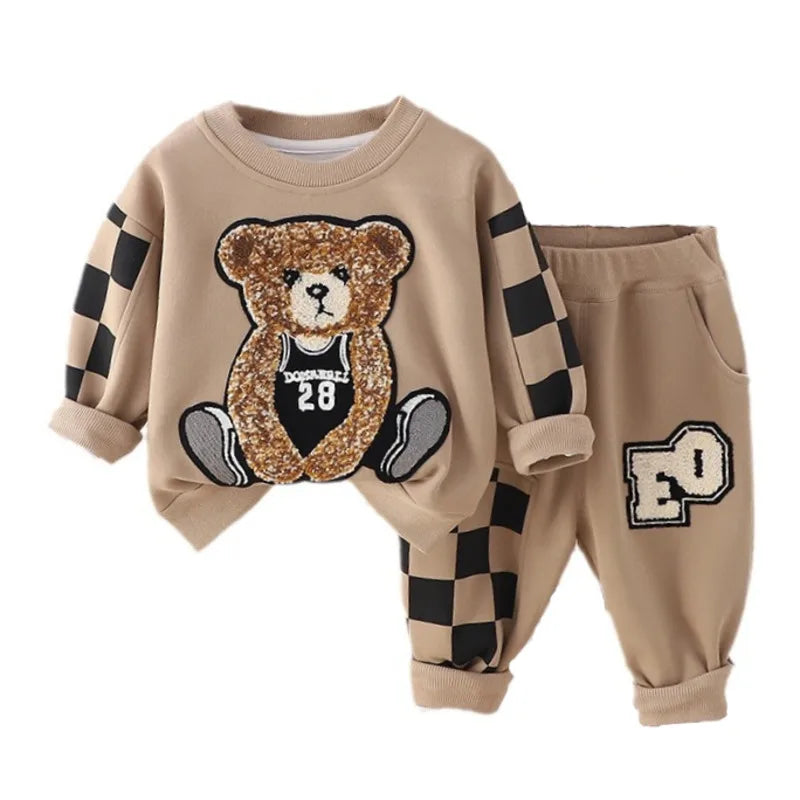 Children's outfit with teddy bear design on a white background