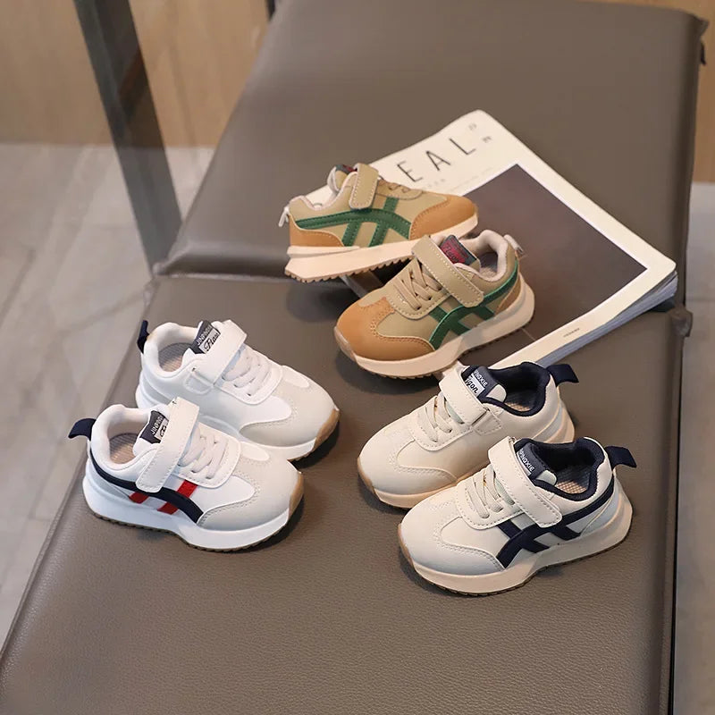 Children's sneakers on a chair with a magazine underneath