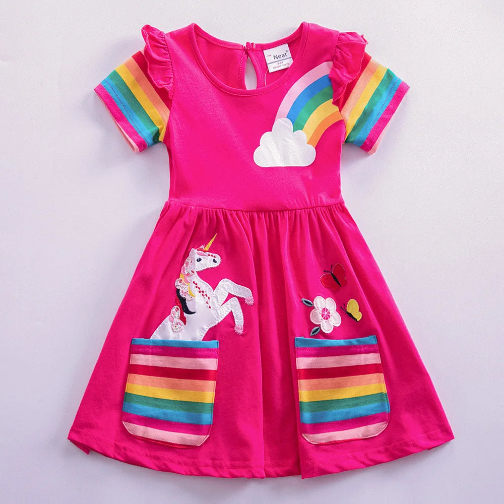 Pink dress with rainbow and unicorn design on a light gray background