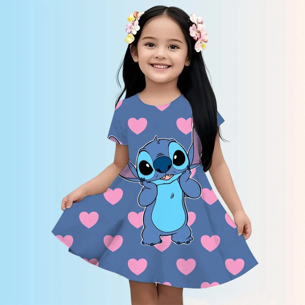 Child wearing a blue dress with cartoon character and pink hearts on a light blue background