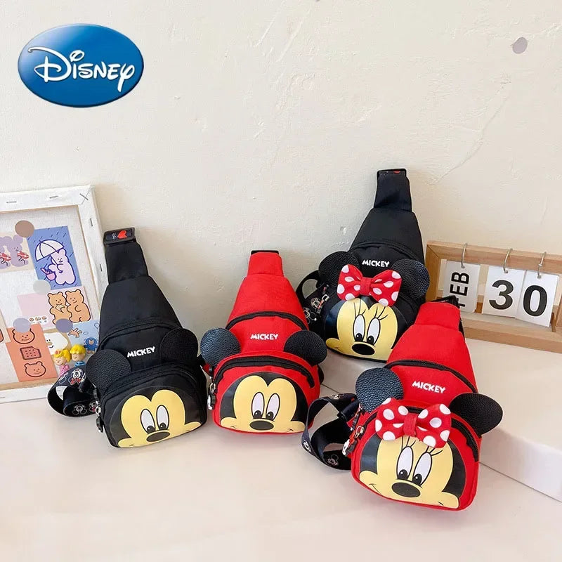 Four cartoon-themed bags with Disney logo on a light background