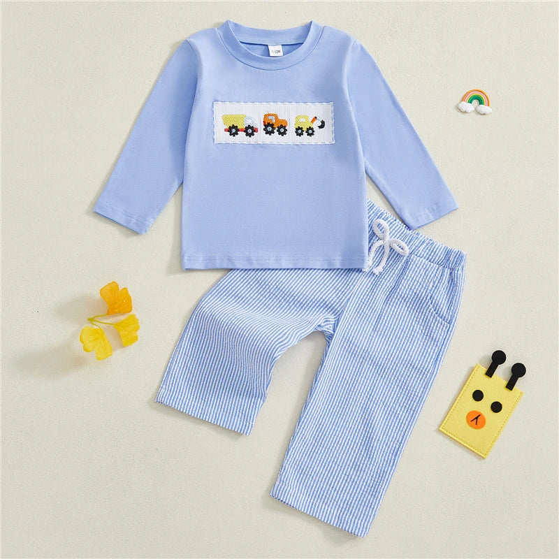 Children's blue outfit with long-sleeve top and striped pants on a beige background