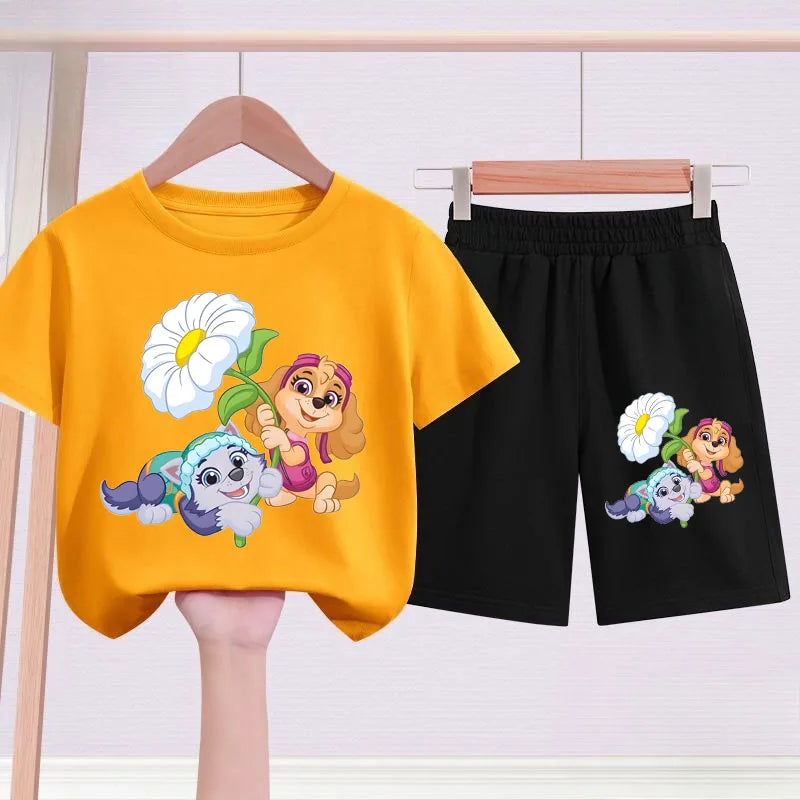 Yellow t-shirt and black shorts with cartoon characters on hangers against a white background