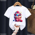 White t-shirt with a colorful cupcake design on a hanger against a dark background.