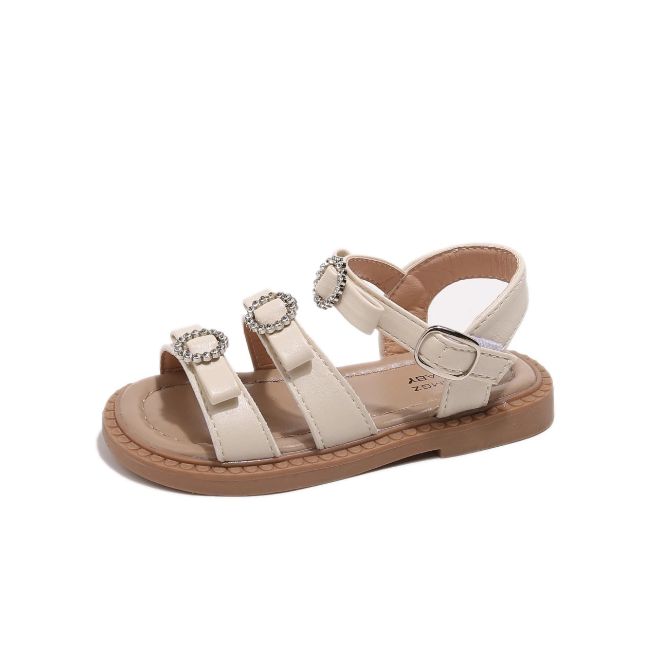 Beige sandal with decorative straps on a white background