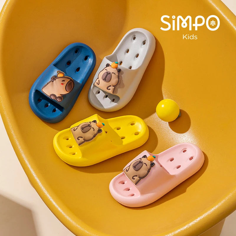 Set of four colorful children's sandals with cartoon character design on a yellow background, featuring the brand 'Simpo Kids'.