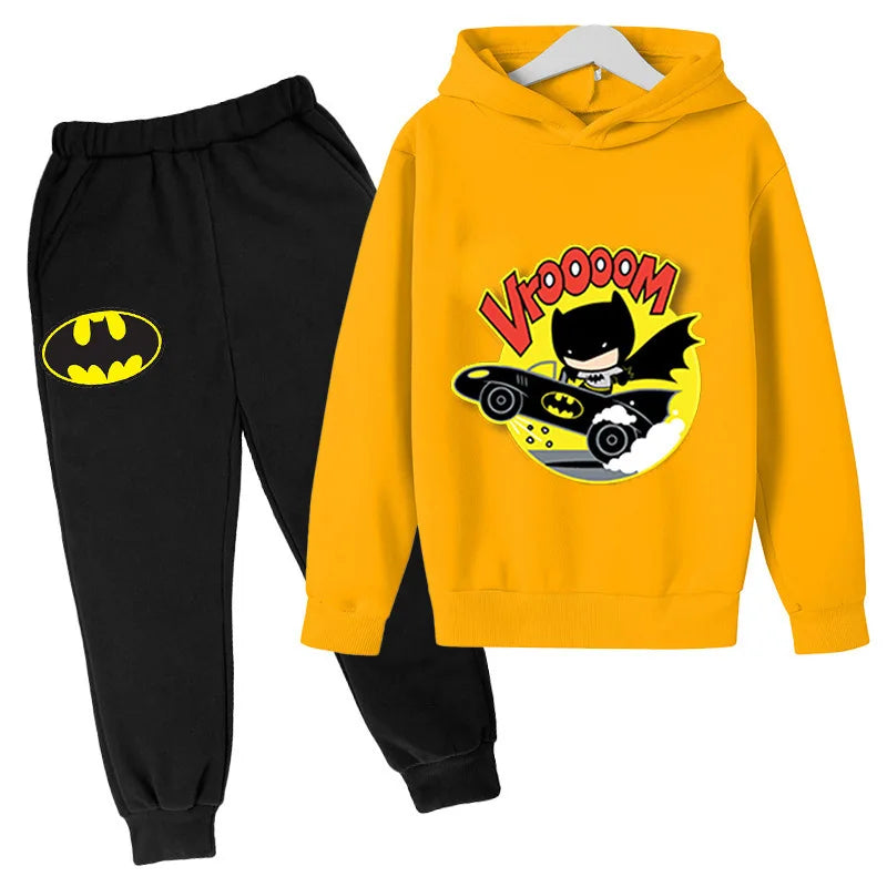 Yellow hoodie with Batman graphic and black pants on a white background