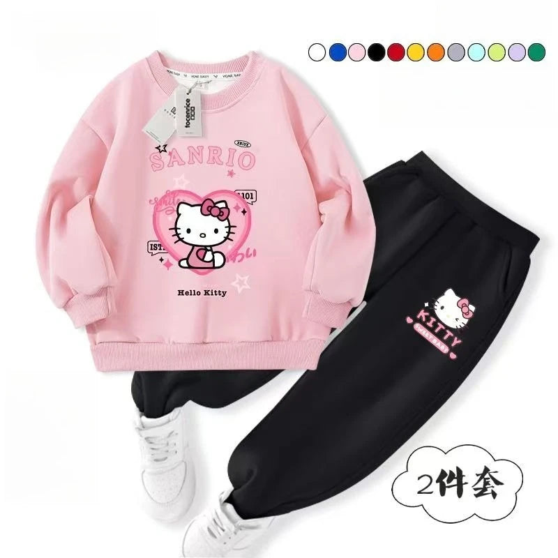 Pink and black children's outfit with Hello Kitty design on a white background