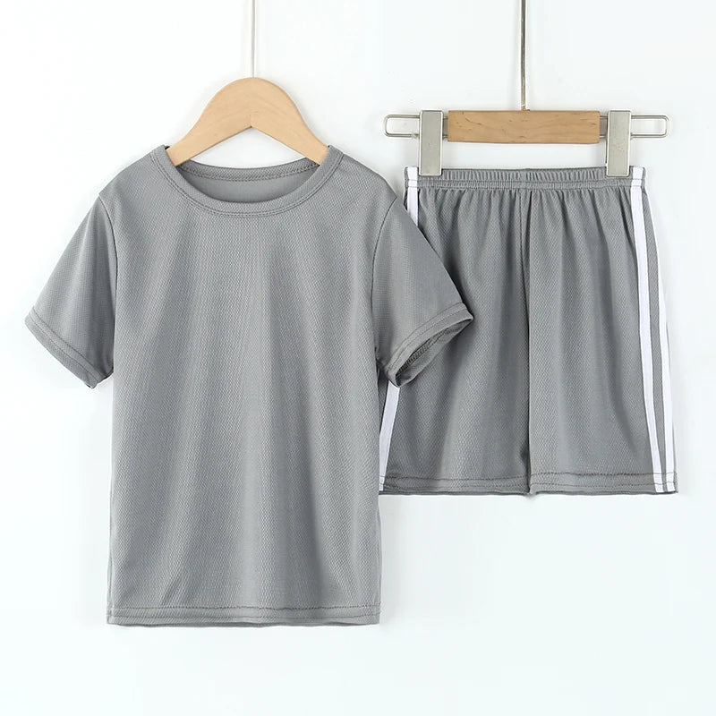 Gray t-shirt and shorts set on hangers against a white background