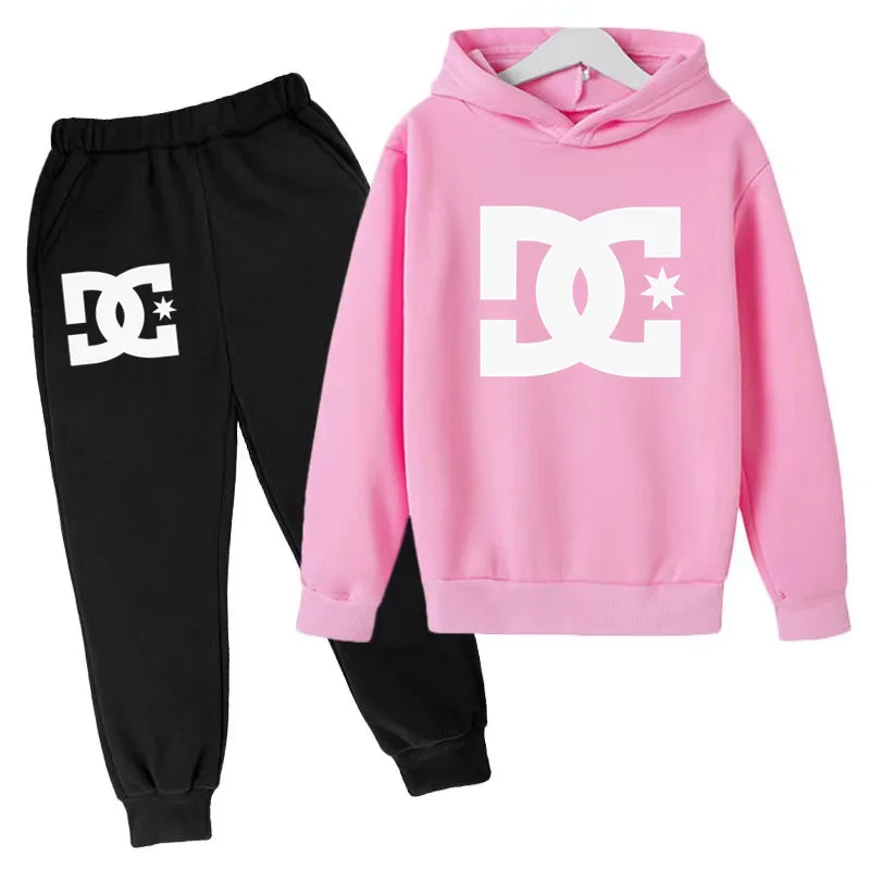 Pink hoodie and black pants with DC logo on a white background