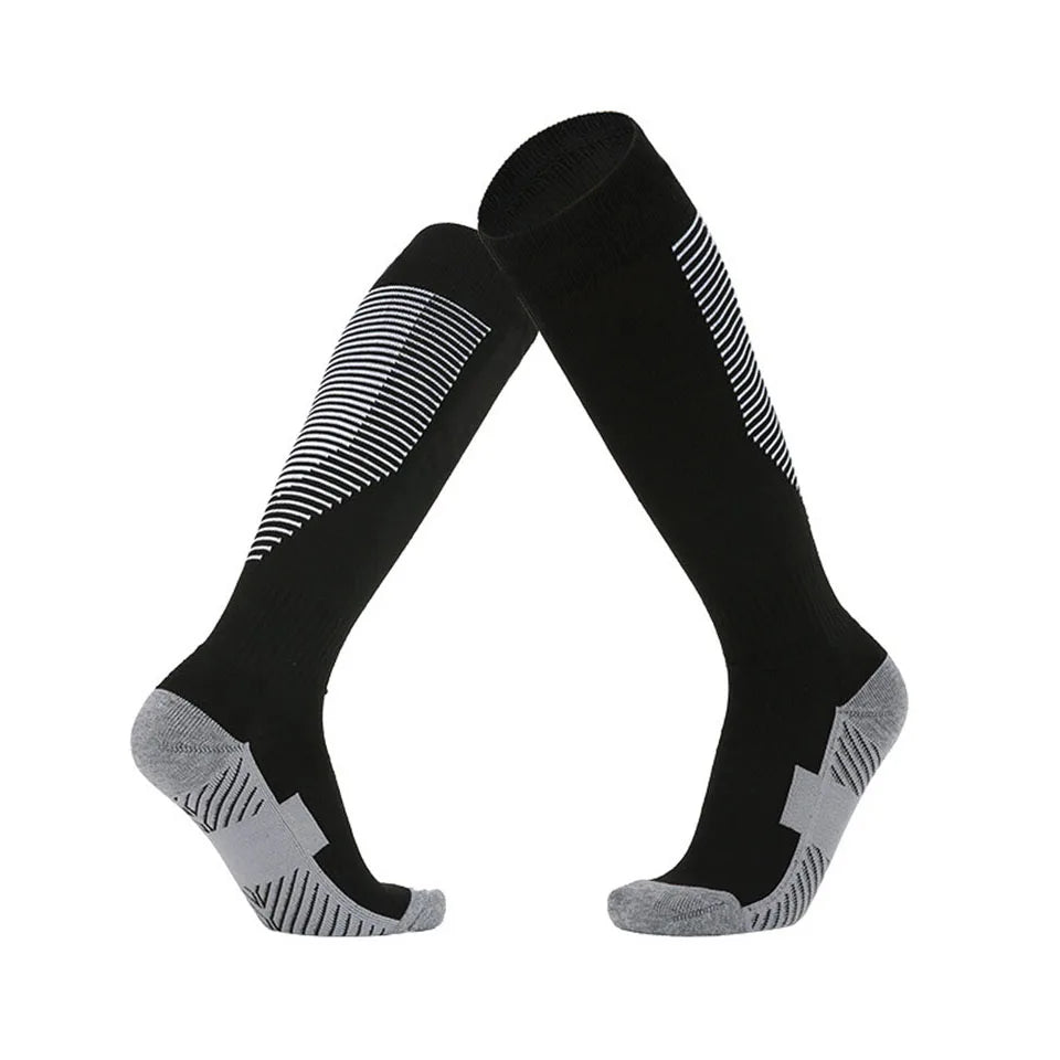 Black knee-high socks with gray toes and heels on a white background