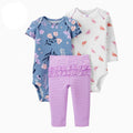 Set of baby clothing including floral bodysuit, striped leggings, and bird-patterned shirt on a white background