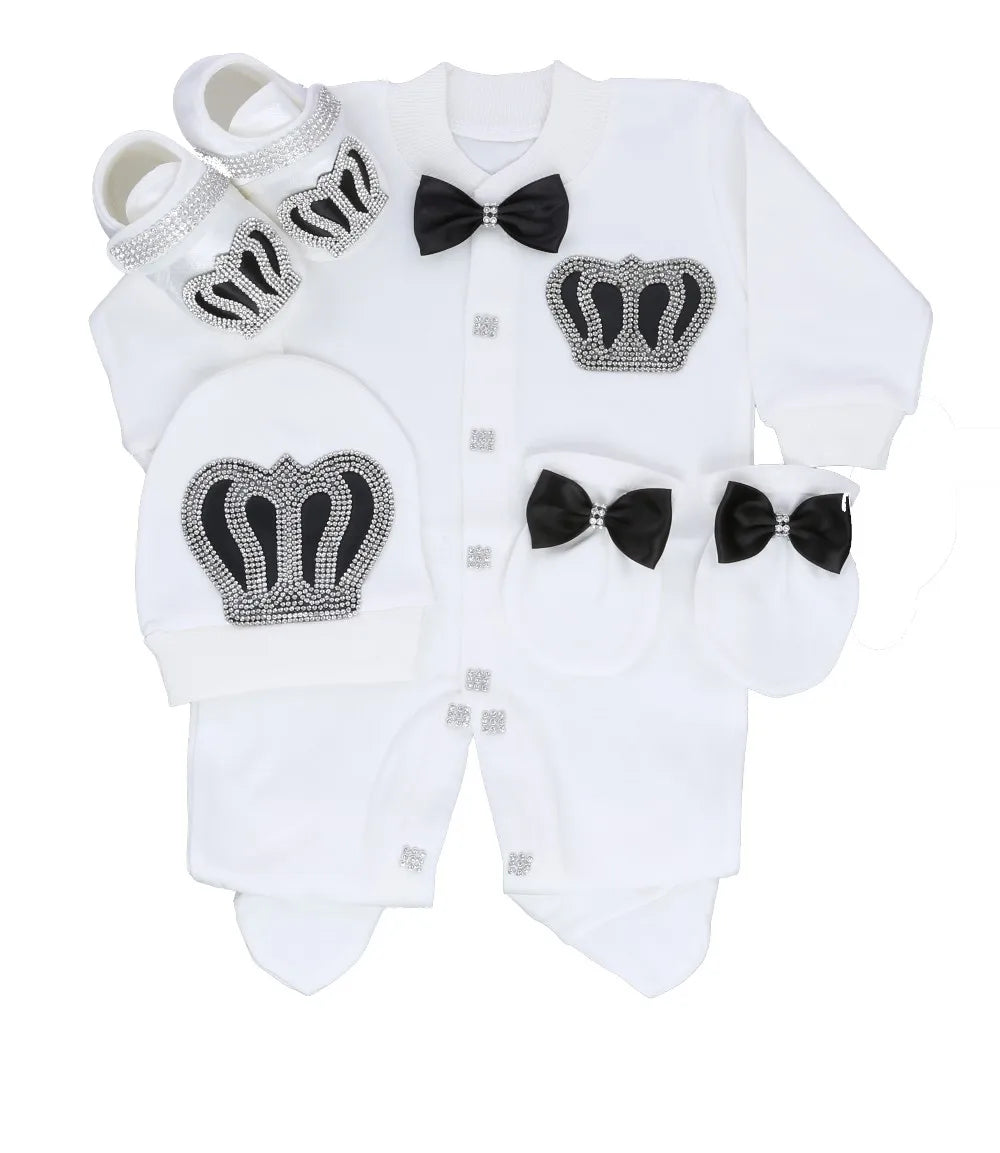 White baby outfit with black bow ties and crowns on a white background