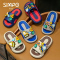 Colorful children's sandals with cartoon designs on a wooden surface, branded 'Simpo Kids'.