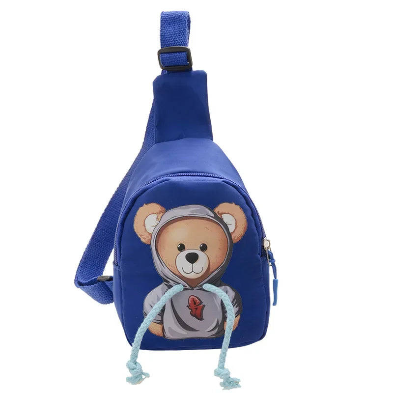 Blue crossbody bag with a teddy bear design on a white background