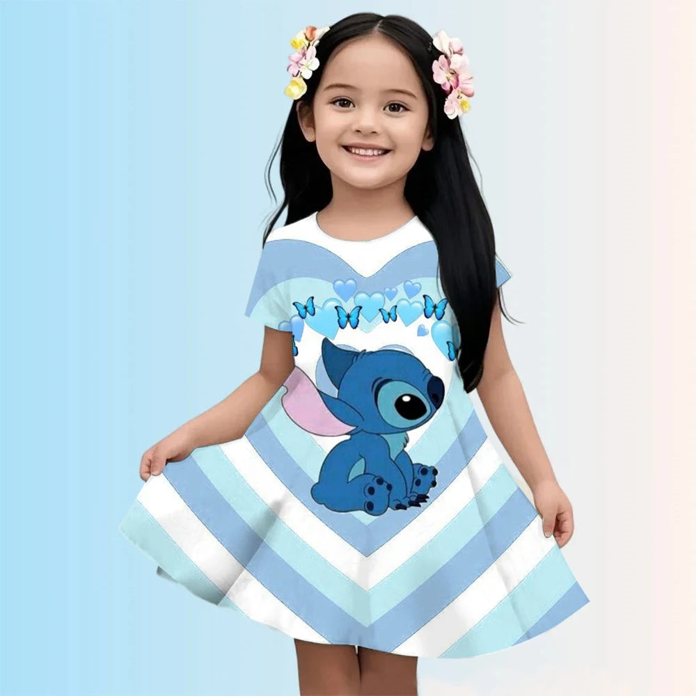 Child wearing a blue and white dress with a cartoon character on a light blue background