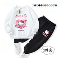 White hoodie and black pants with Hello Kitty design on a white background